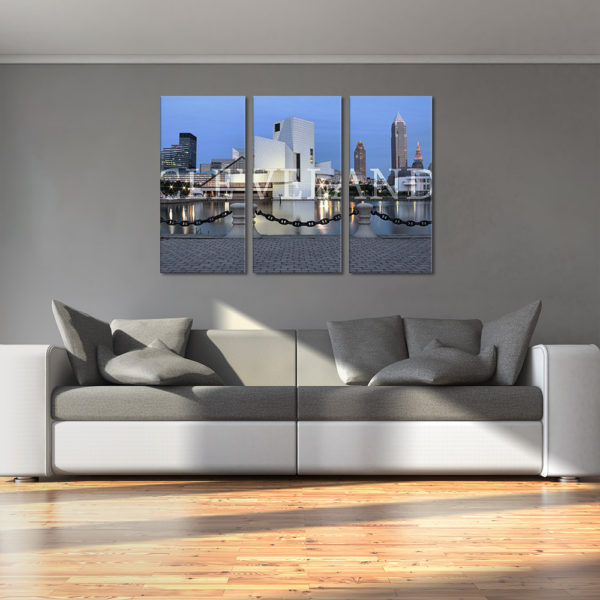 Photograph on 3 panel canvas in the living room. Photography of the Rock and Roll Hall of Fame and Cleveland Skyline after sunset.