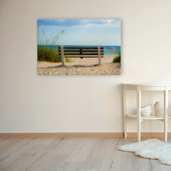 Photograph on canvas of a bench at the beach overlooking the ocean.