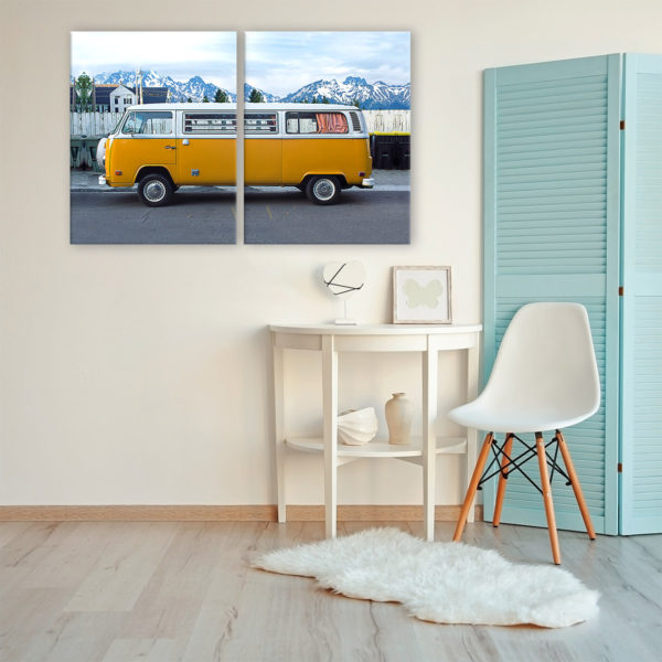 Photograph on a 2 panel canvas of a yellow VW bus on the street in front of a mountain landscape.